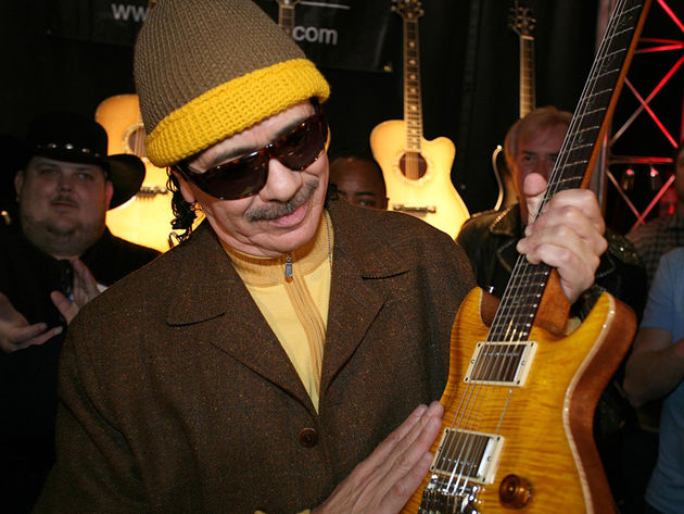 blank Carlos Santana at NAMM 2008 with his new signature model